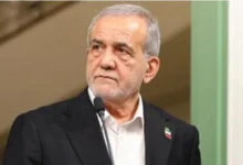Iranian President Masoud Pezeshkian addressing a national event while emphasizing peace and Iran's commitment to defending its borders.